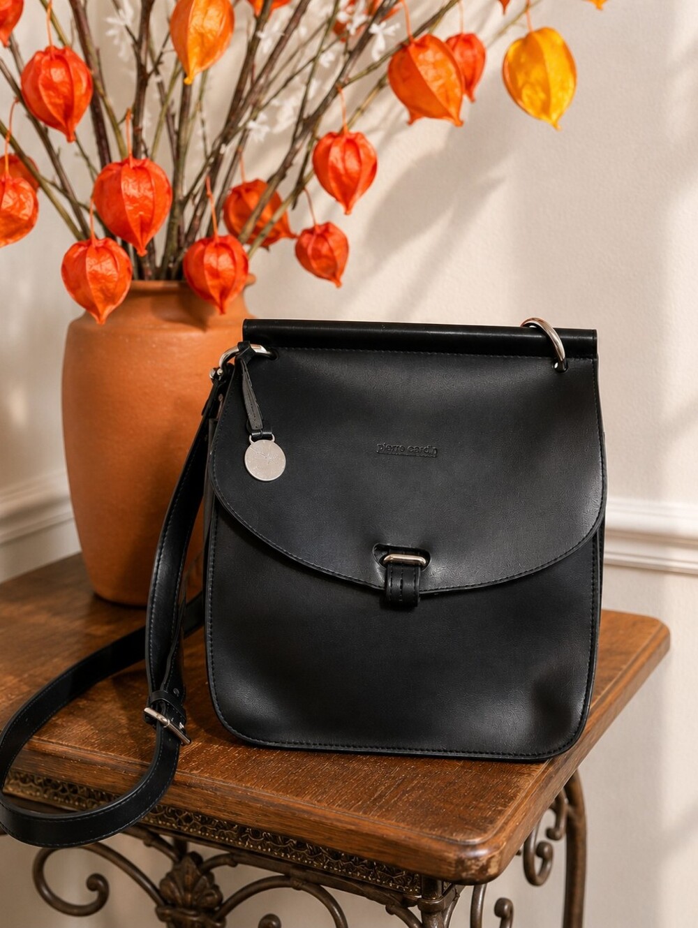 Dooney & Bourke Black Leather Crossbody with Silver Tone Charm